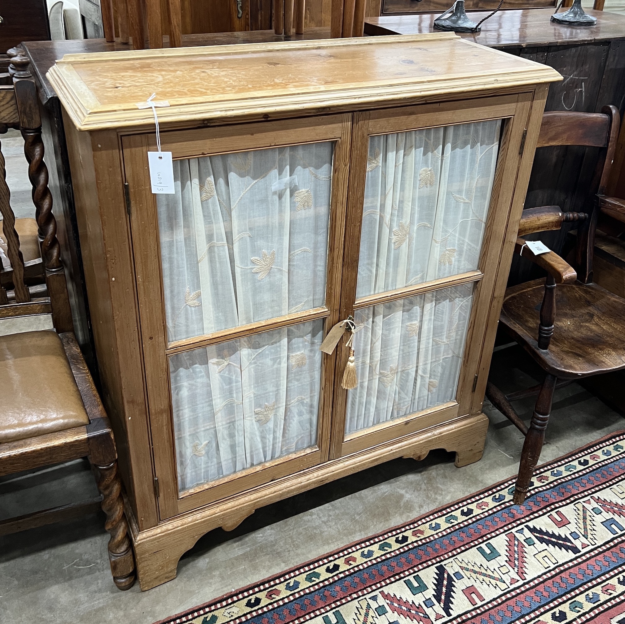 A Victorian and later glazed pine two door side cabinet, width 93cm, depth 33cm, height 108cm
